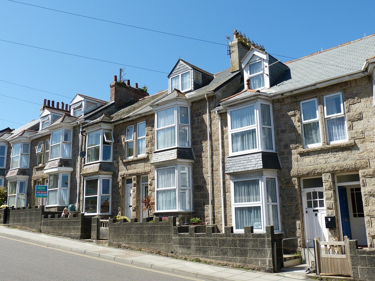 A classic row of UK terraced houses representing a property portfolio